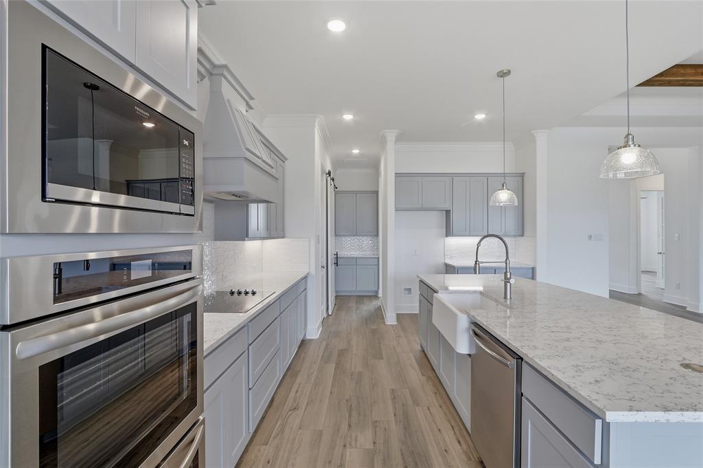 808 Vly Rdg Road Van Alstyne, TX 75495 - Photo 11 of 39 a large kitchen with stainless steel appliances granite countertop a lot of counter space
