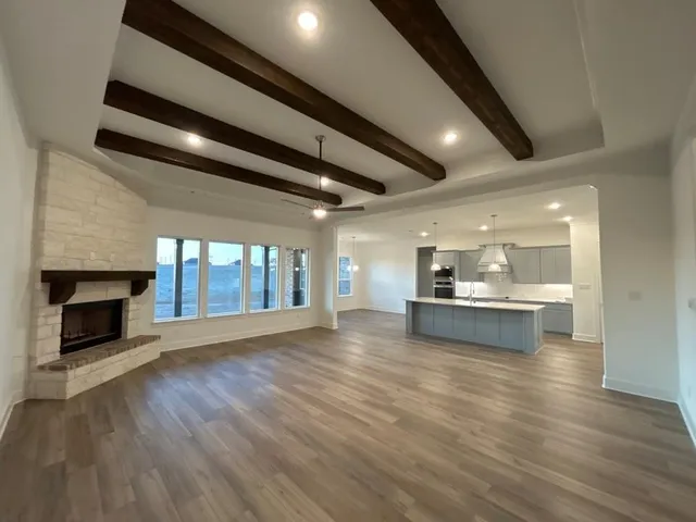 a view of dining room with furniture and fireplace