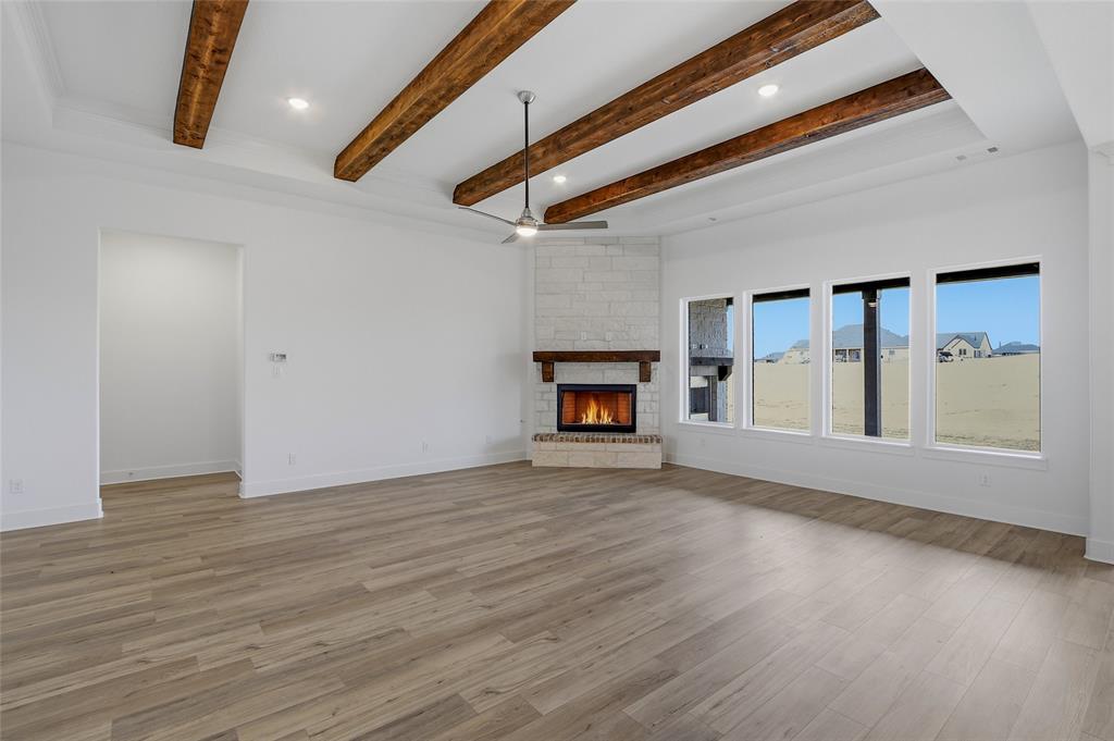 808 Vly Rdg Road Van Alstyne, TX 75495 - Photo 14 of 39 a view of an empty room with wooden floor and a window