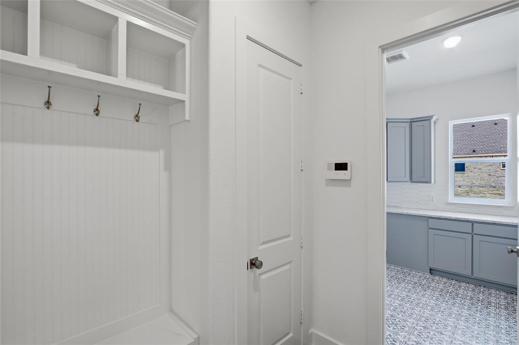 808 Vly Rdg Road Van Alstyne, TX 75495 - Photo 17 of 39 a bathroom with a sink and mirror