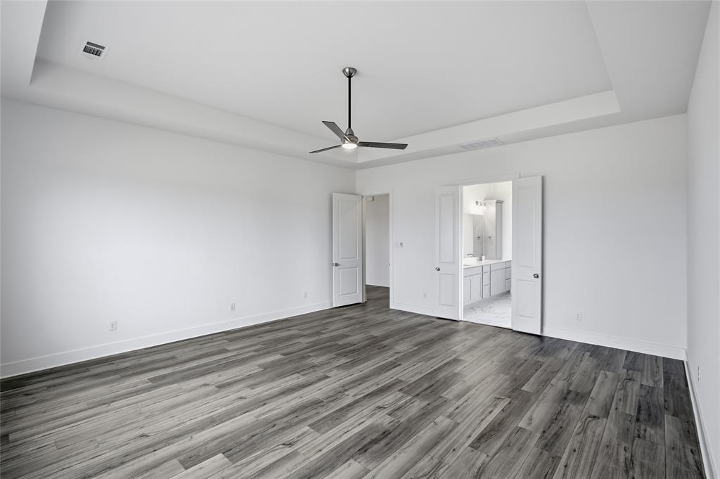 808 Vly Rdg Road Van Alstyne, TX 75495 - Photo 22 of 39 a view of a room with wooden floor and white walls