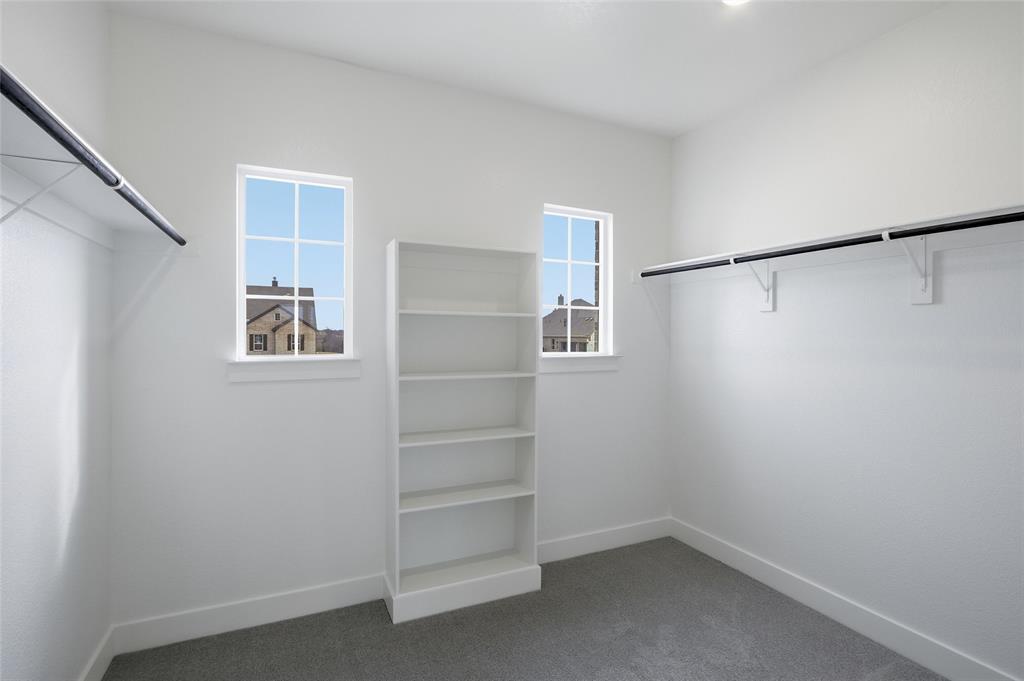 808 Vly Rdg Road Van Alstyne, TX 75495 - Photo 27 of 39 a view of walk in closet with empty racks