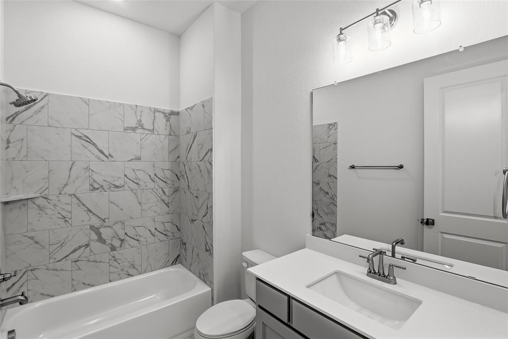 808 Vly Rdg Road Van Alstyne, TX 75495 - Photo 29 of 39 a bathroom with a sink toilet and shower