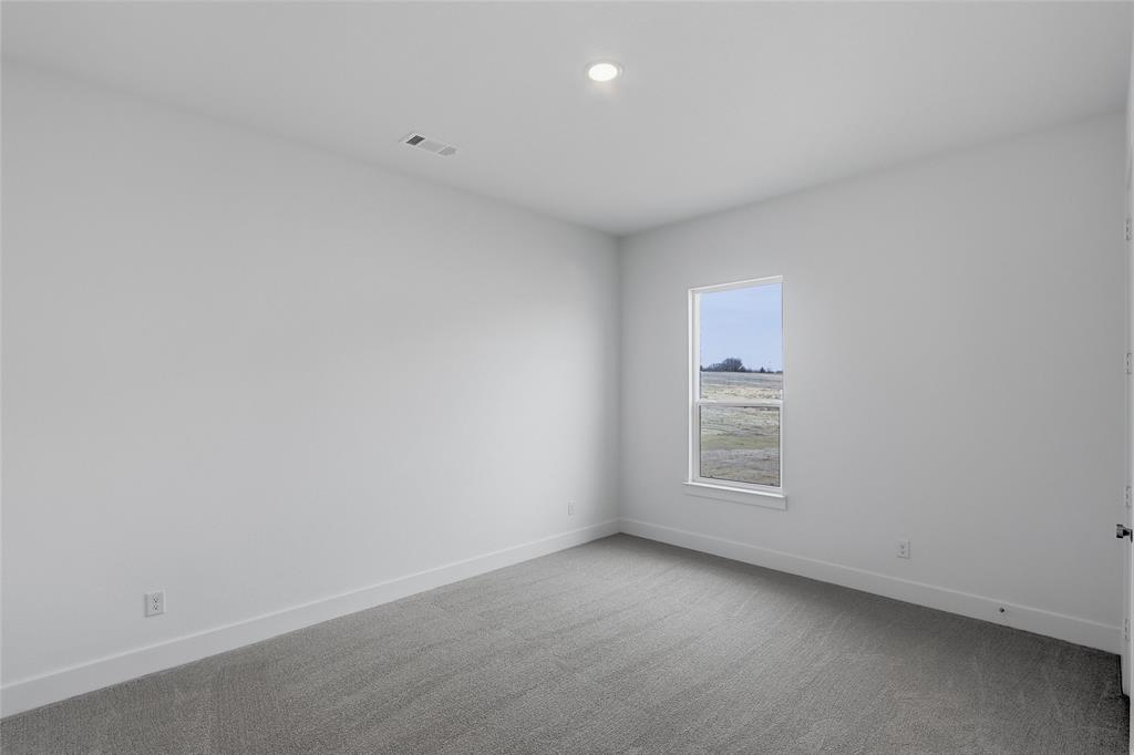 808 Vly Rdg Road Van Alstyne, TX 75495 - Photo 33 of 39 an empty room with a window