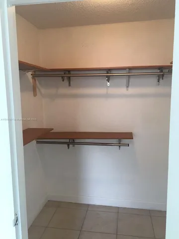 a view of a swimming pool with a yard