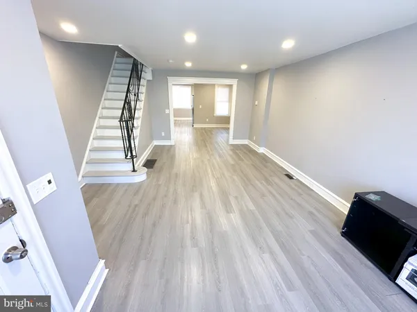 a view of entryway with wooden floor