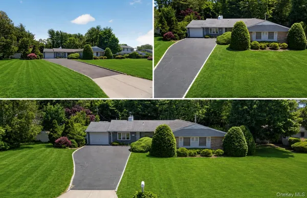 a view of house with a yard