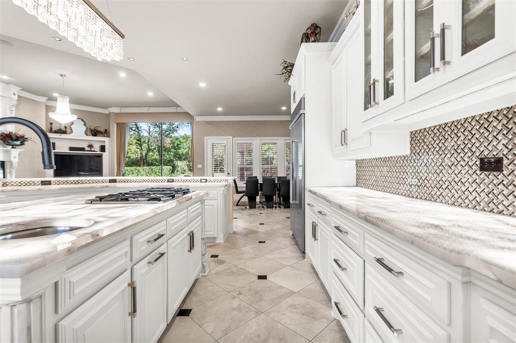 8600 Riviera Court Flower Mound, TX 75022 - Photo 11 of 40 a large white kitchen with a large window