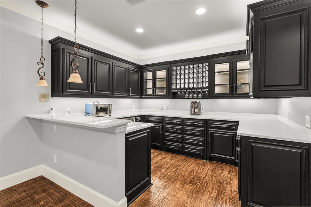 8600 Riviera Court Flower Mound, TX 75022 - Photo 19 of 40 a kitchen with stainless steel appliances granite countertop a sink stove and cabinets