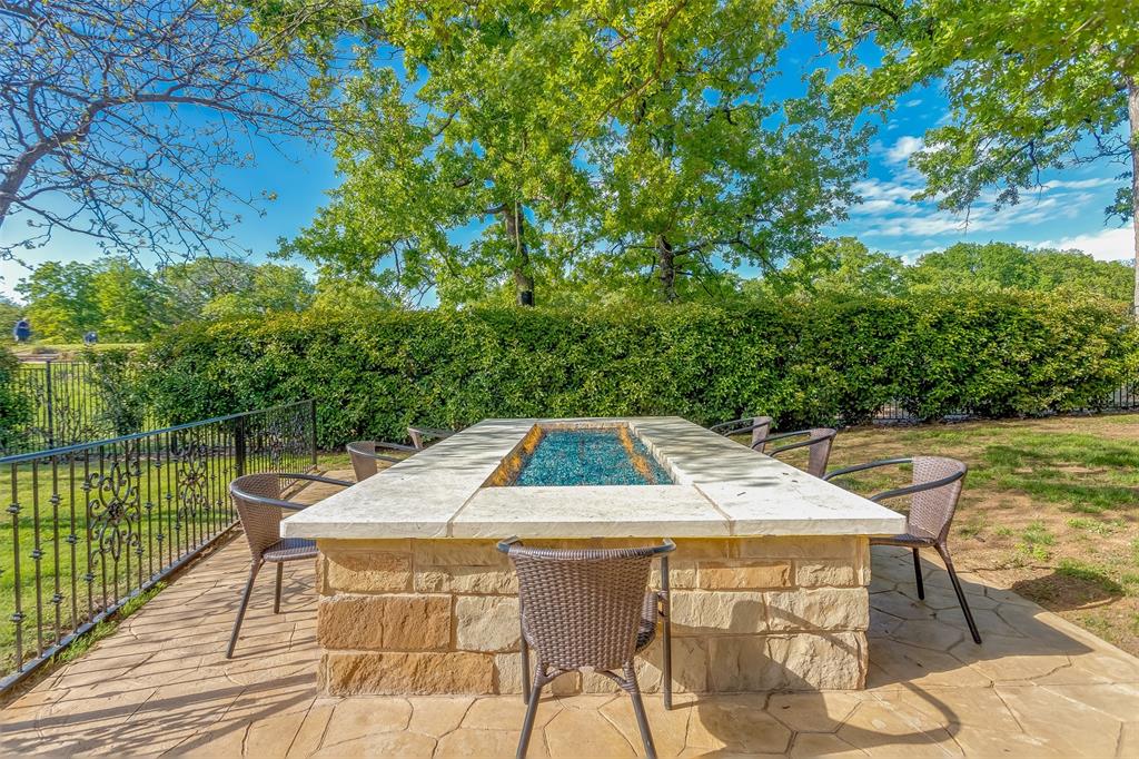 8600 Riviera Court Flower Mound, TX 75022 - Photo 31 of 40 a view of a swimming pool with a patio