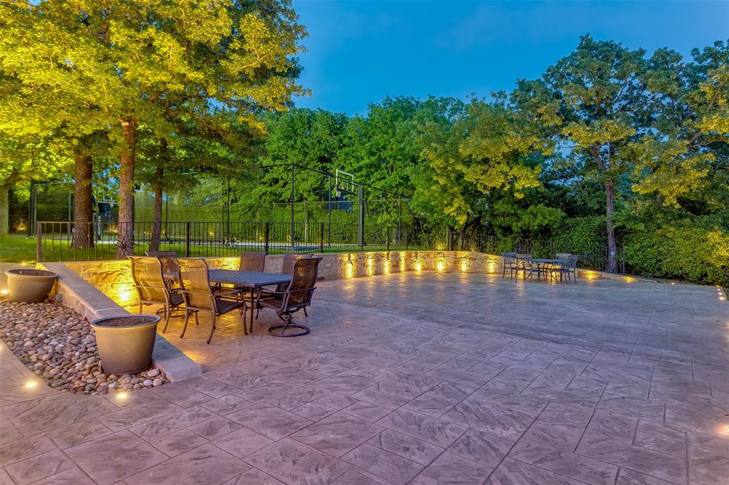 8600 Riviera Court Flower Mound, TX 75022 - Photo 38 of 40 a view of a swimming pool with a patio and a yard