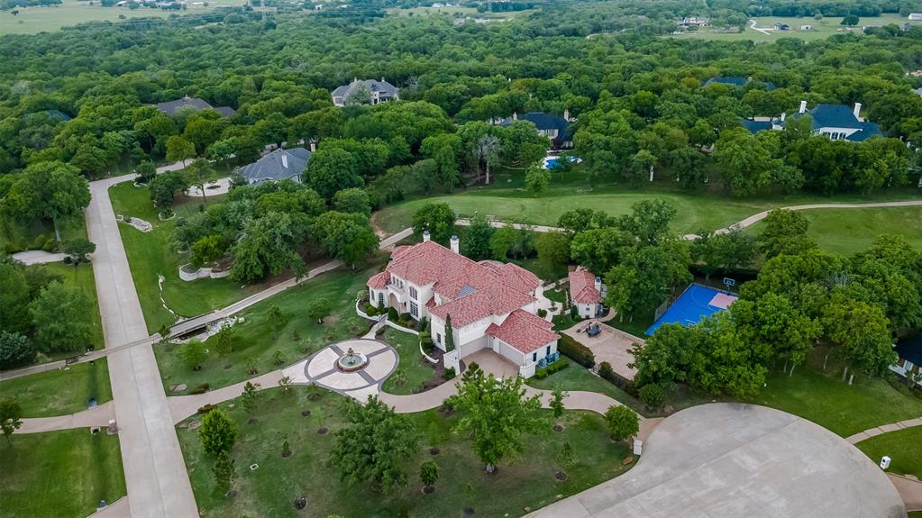 8600 Riviera Court Flower Mound, TX 75022 - Photo 4 of 40 an aerial view of a house with pool outdoor seating and yard