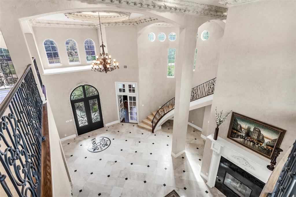 8600 Riviera Court Flower Mound, TX 75022 - Photo 6 of 40 a living room with furniture and a fireplace