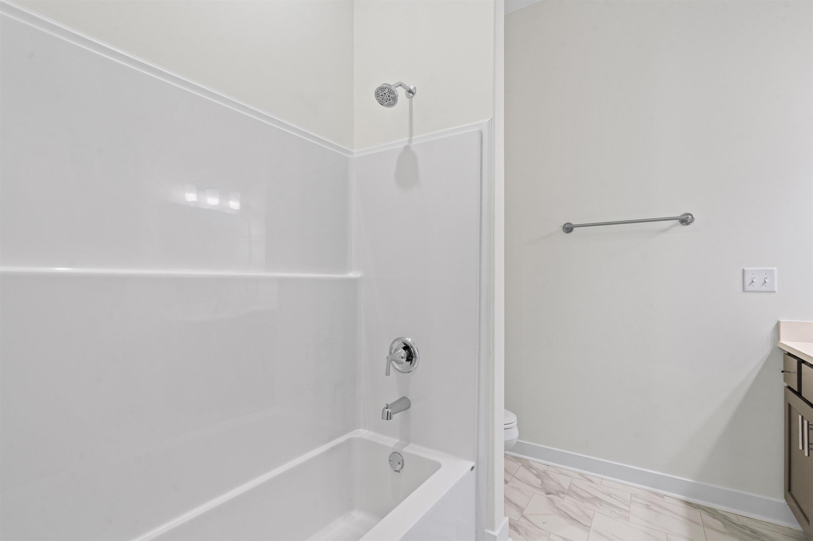 5666 Pleasant Pk Place Arlington, TN 38002 - Photo 6 of 27 Bathtub with an integrated shower, chrome fixtures, and a multi-setting showerhead