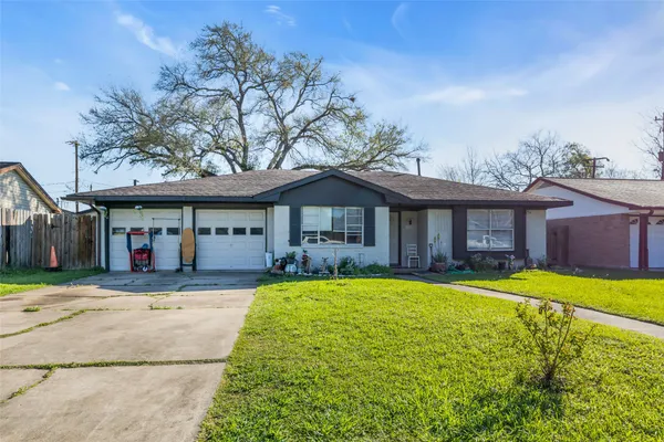 a front view of a house with a yard porch and outdoor seating