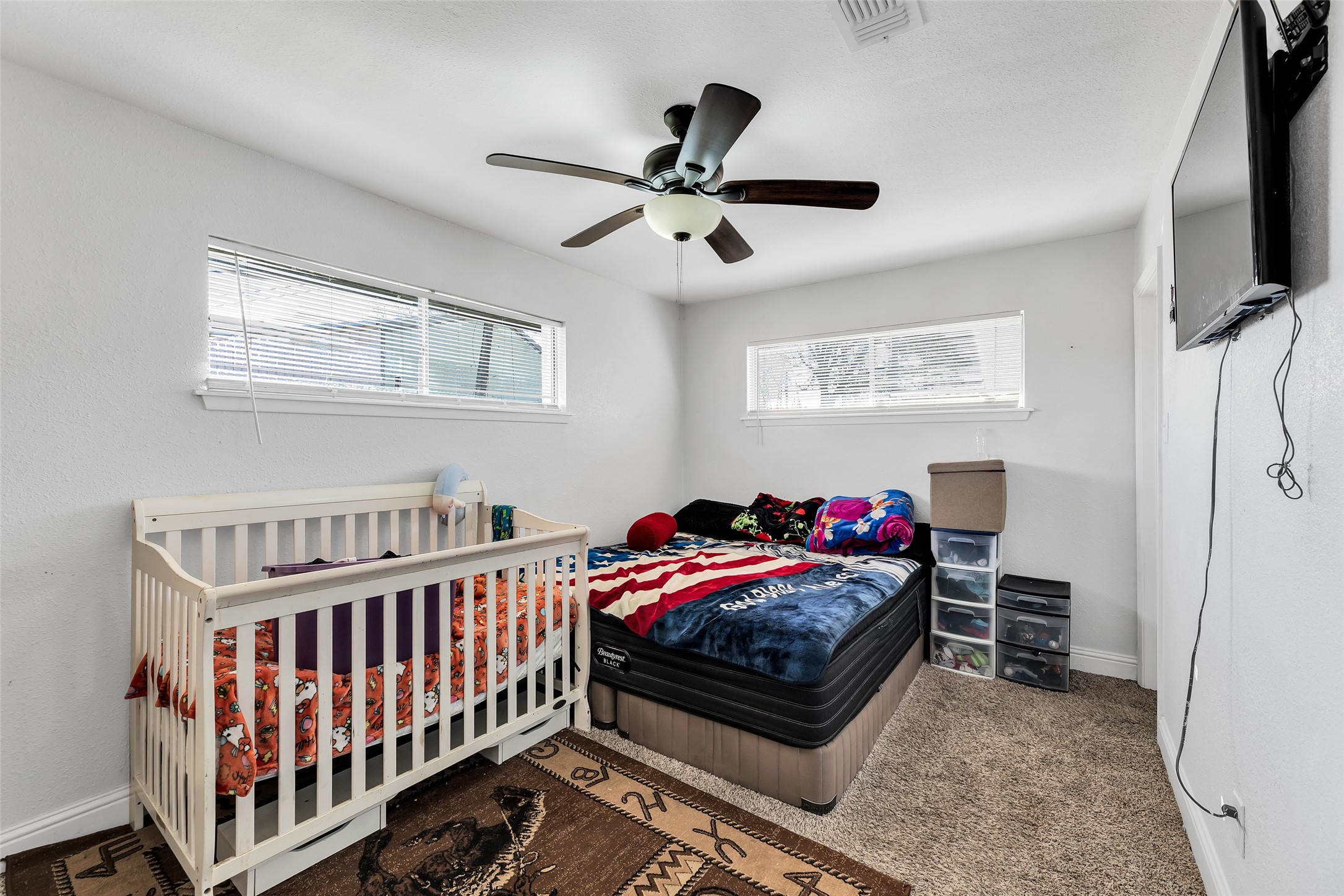 819 Hackberry Street Stafford, TX 77477 - Photo 11 of 23 a bedroom with furniture and a window