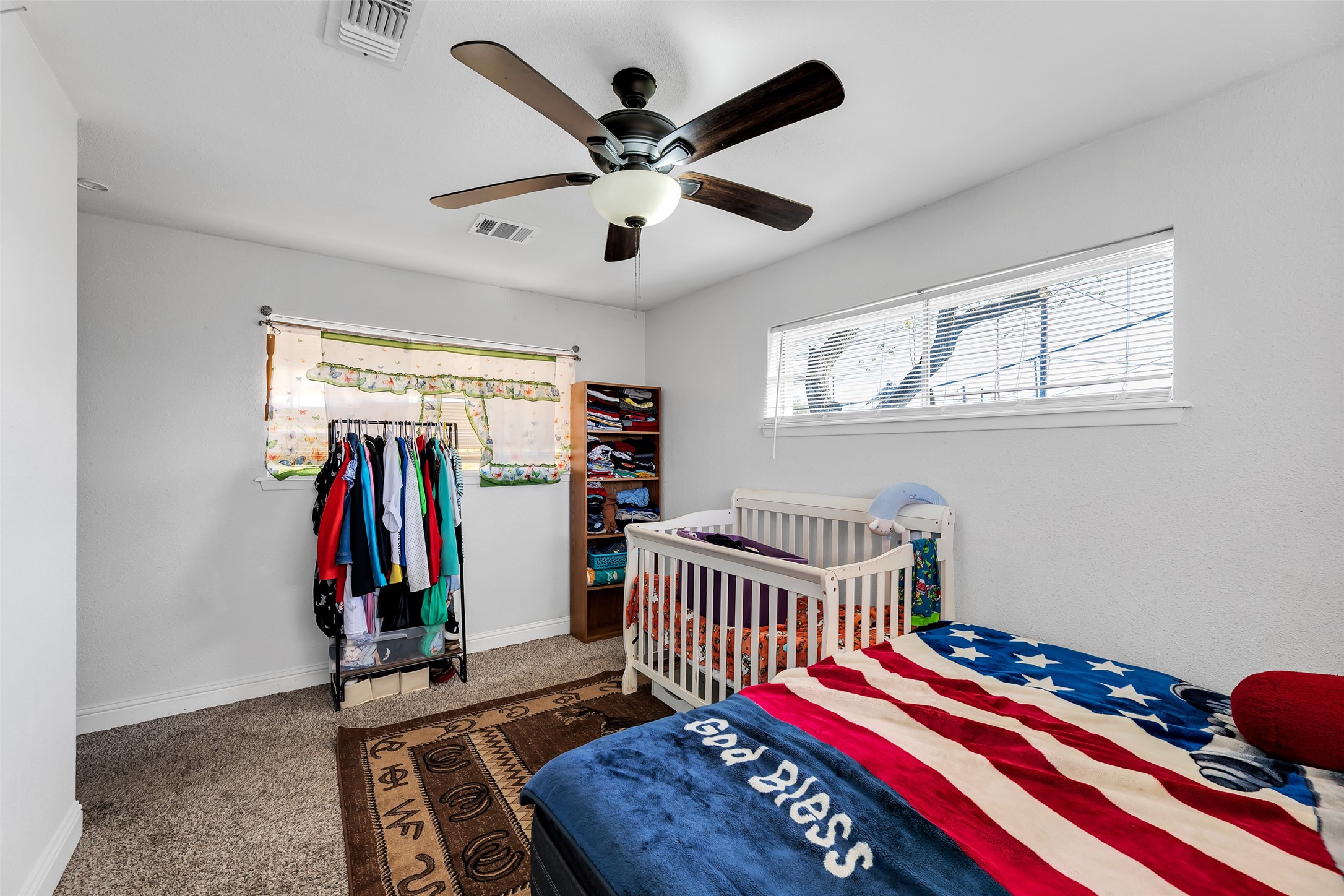 819 Hackberry Street Stafford, TX 77477 - Photo 12 of 23 a bedroom with furniture and a window