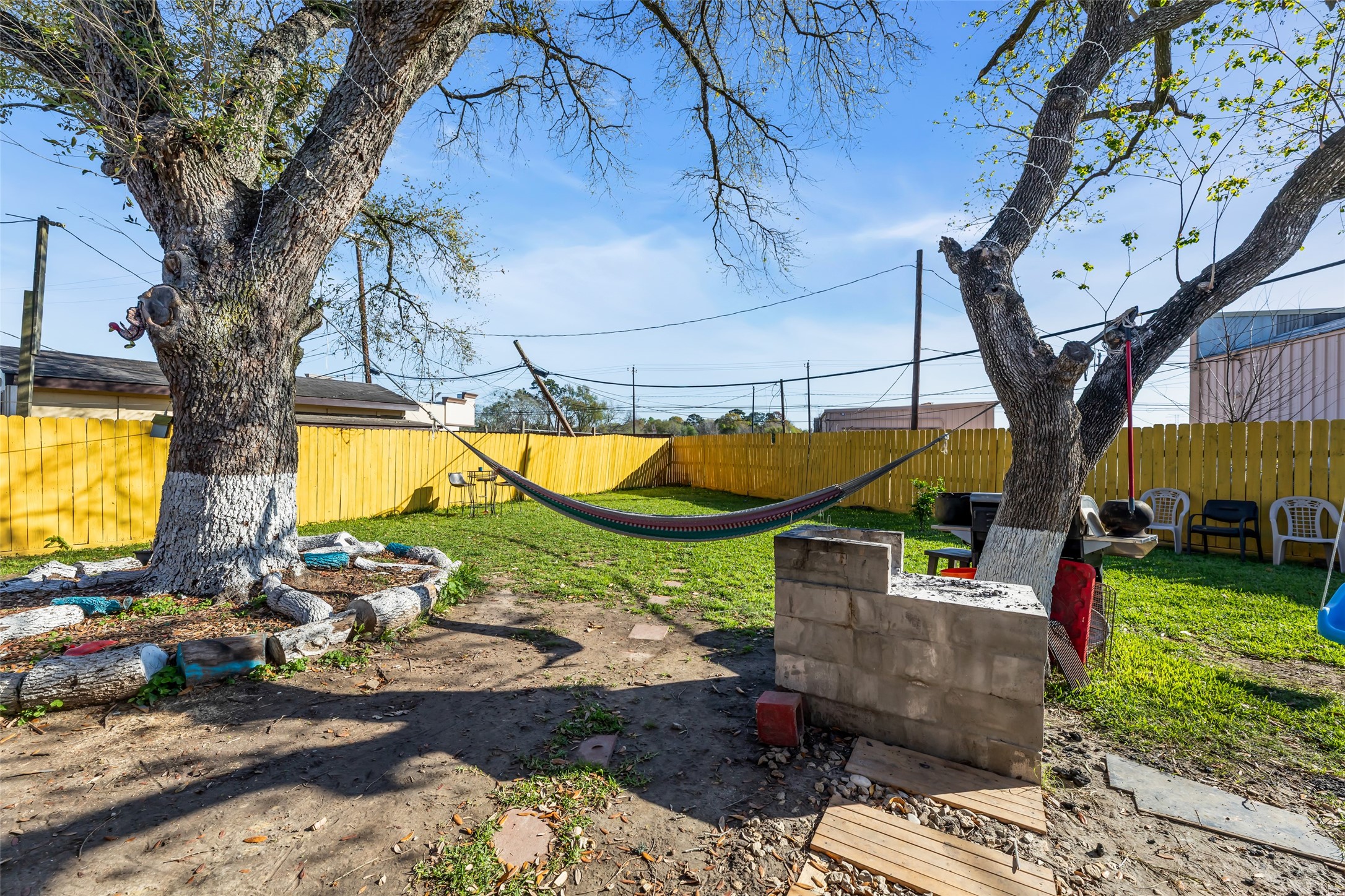 819 Hackberry Street Stafford, TX 77477 - Photo 21 of 23 a view of a backyard with couches plants and large trees