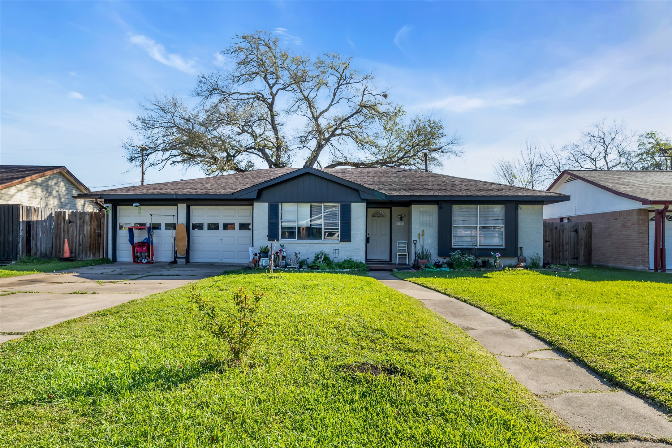 819 Hackberry Street Stafford, TX 77477 - Photo 5 of 23 a front view of a house with a yard