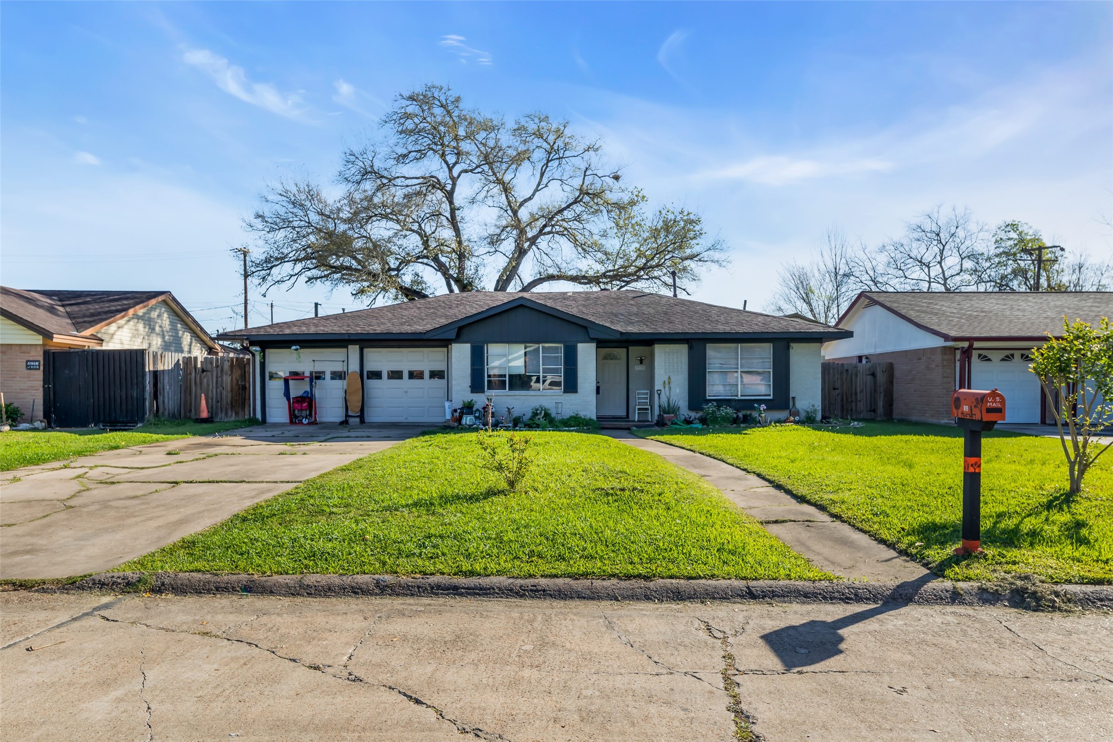 819 Hackberry Street Stafford, TX 77477 - Photo 7 of 23 a front view of a house with a garden