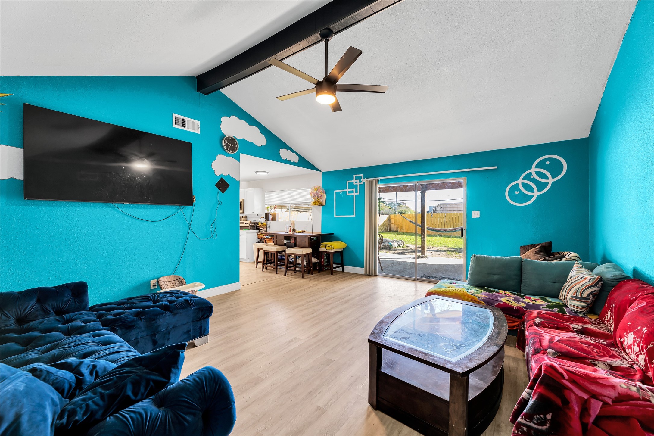 819 Hackberry Street Stafford, TX 77477 - Photo 9 of 23 a living room with furniture and a flat screen tv