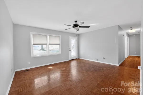 a view of an empty room with a window