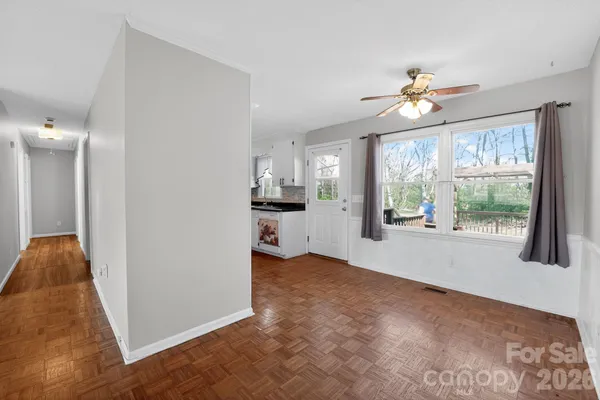 a kitchen with granite countertop a sink stove and cabinets