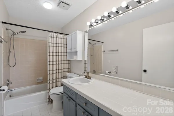 a view of a room with wooden furniture