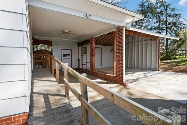 a view of a yard with large trees