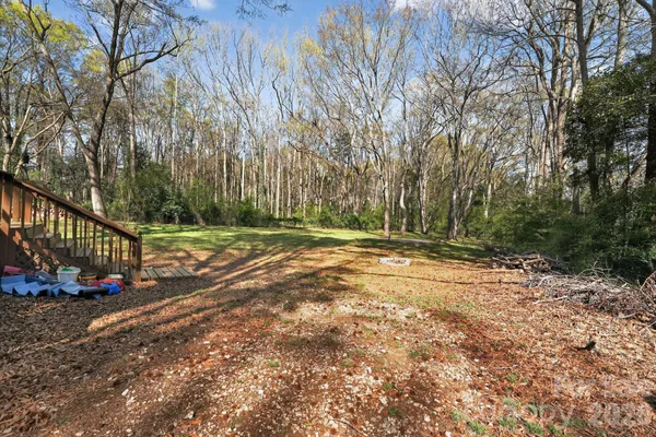 a view of a house with a tree
