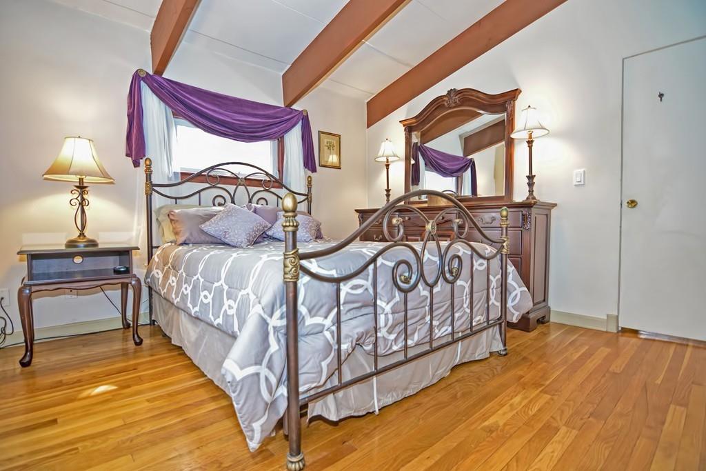 45 Walnut Street Millis, MA 02054 - Photo 13 of 32 a bedroom with a bed and a lamp on dresser
