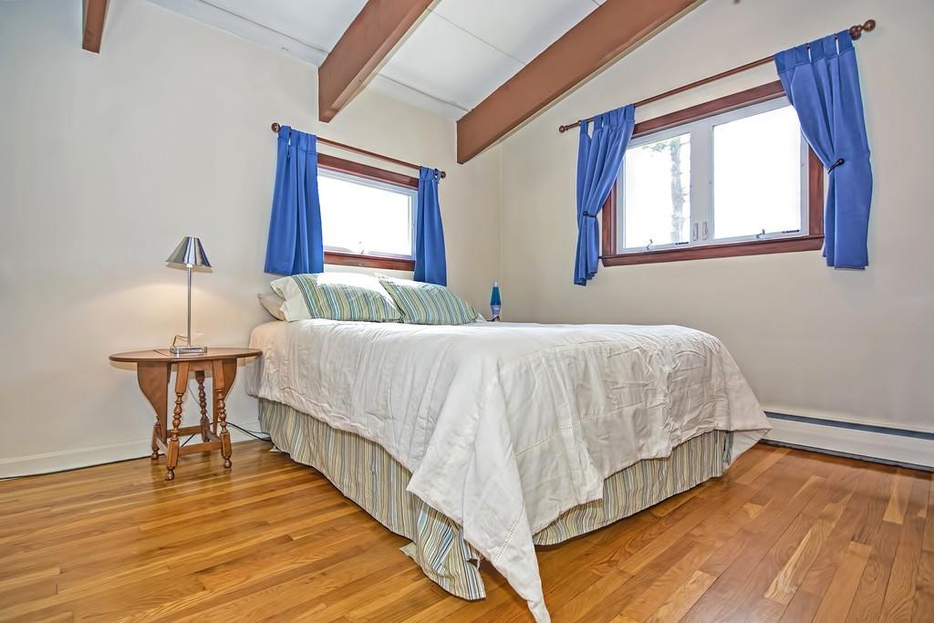 45 Walnut Street Millis, MA 02054 - Photo 14 of 32 a bedroom with a bed and wooden floor