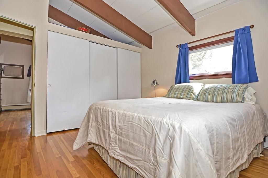 45 Walnut Street Millis, MA 02054 - Photo 15 of 32 a bedroom with a bed and wooden floor
