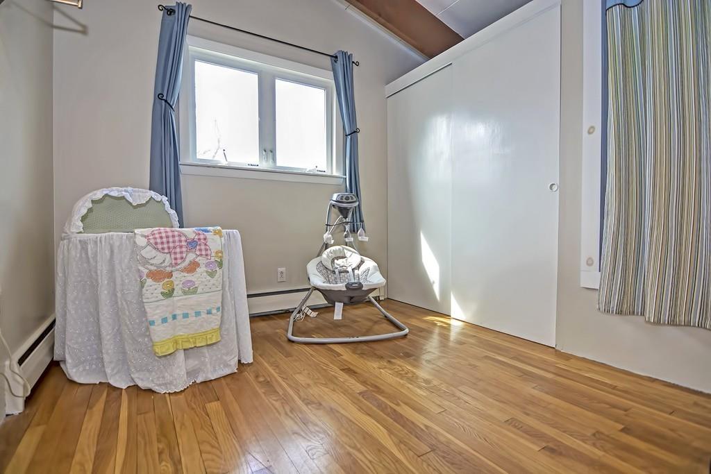 45 Walnut Street Millis, MA 02054 - Photo 16 of 32 an empty room with wooden floor and windows