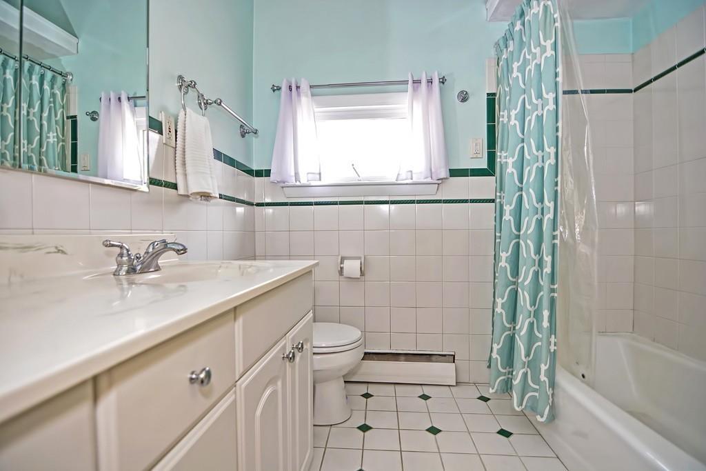 45 Walnut Street Millis, MA 02054 - Photo 18 of 32 a bathroom with a sink a toilet and shower