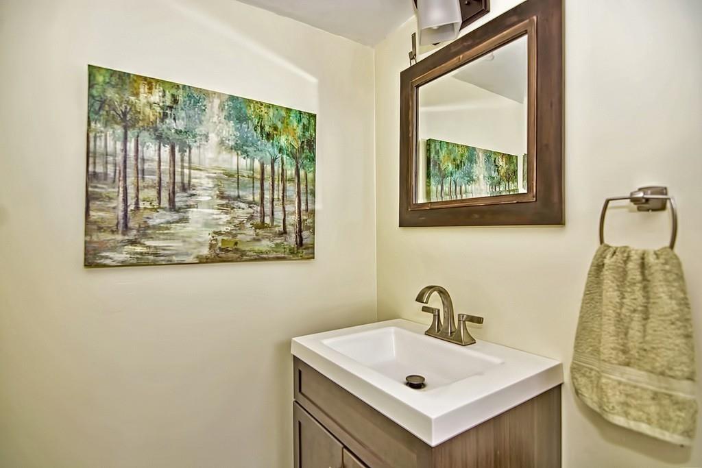 45 Walnut Street Millis, MA 02054 - Photo 24 of 32 a bathroom with a sink and mirror with window
