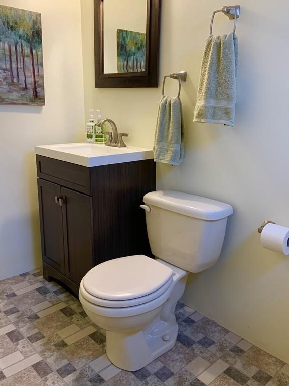 45 Walnut Street Millis, MA 02054 - Photo 25 of 32 a bathroom with a toilet sink and mirror