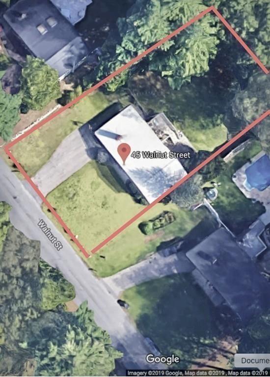 45 Walnut Street Millis, MA 02054 - Photo 29 of 32 a view of a backyard with wooden fence