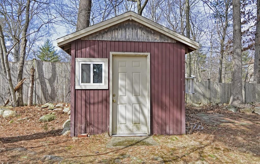 45 Walnut Street Millis, MA 02054 - Photo 30 of 32 a view of a small house with a yard