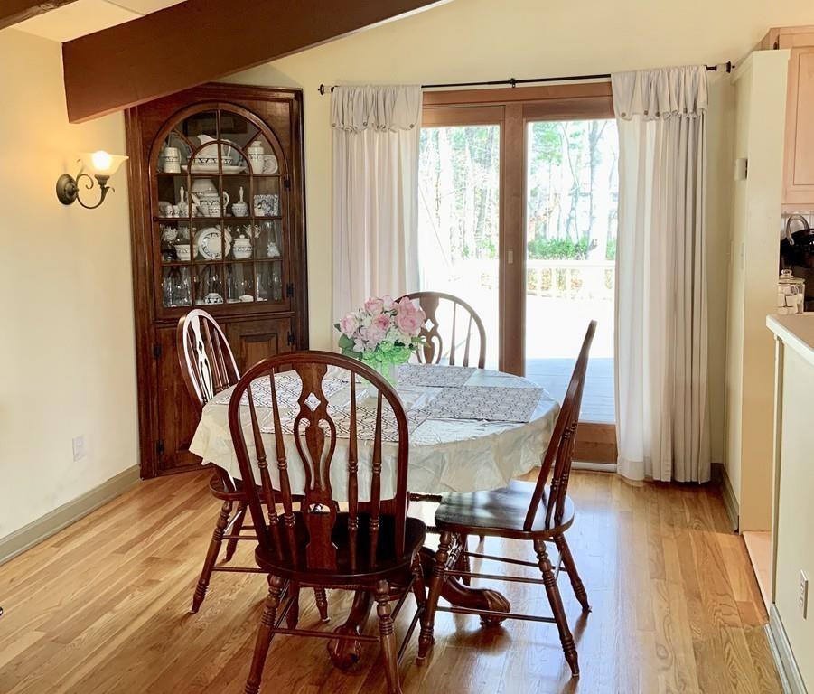 45 Walnut Street Millis, MA 02054 - Photo 7 of 32 a view of a dining room with furniture and wooden floor