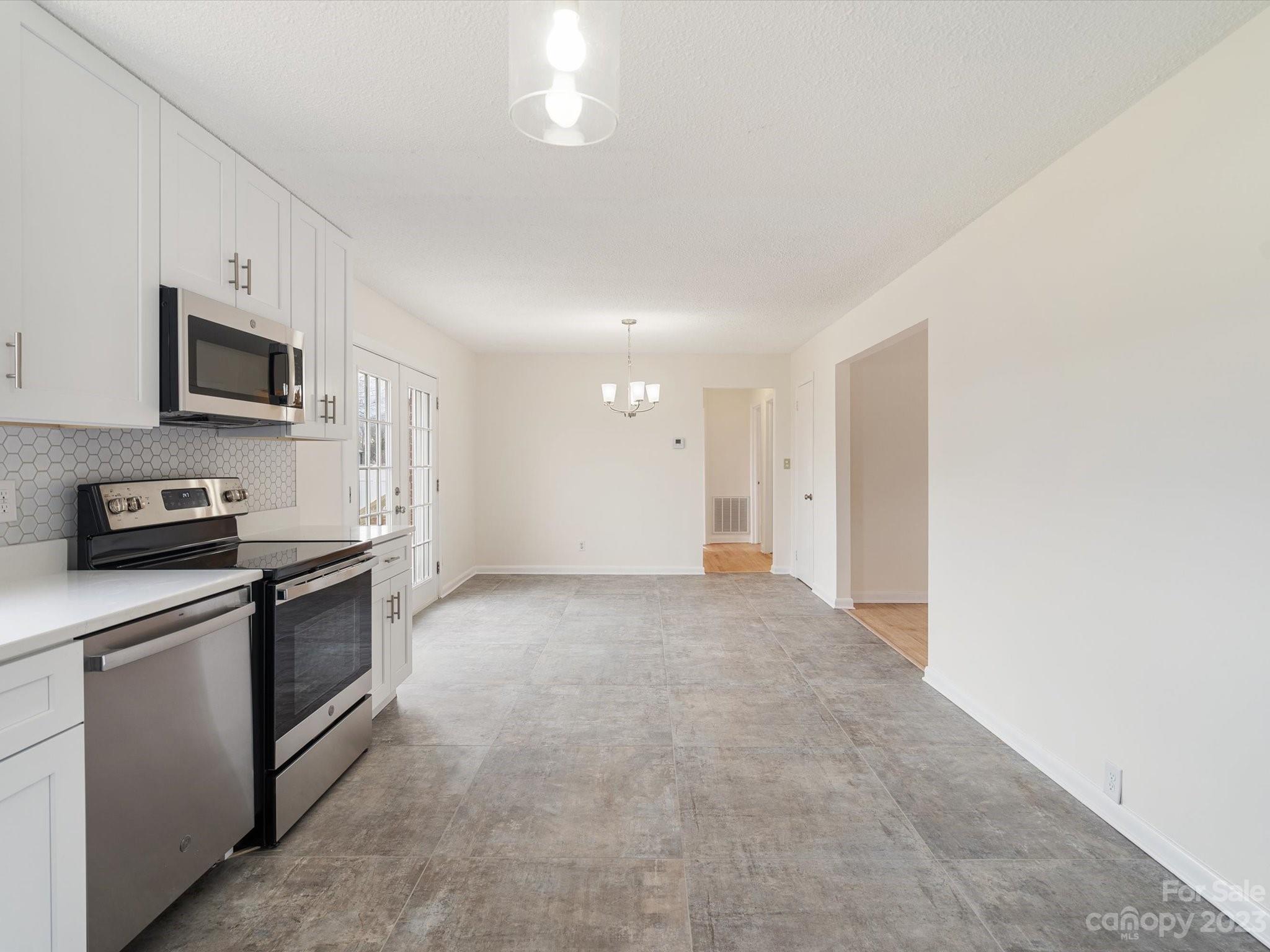 158 Baxter Road Cherryville, NC 28021 - Photo 12 of 38 a view of a kitchen with a sink microwave and cabinets