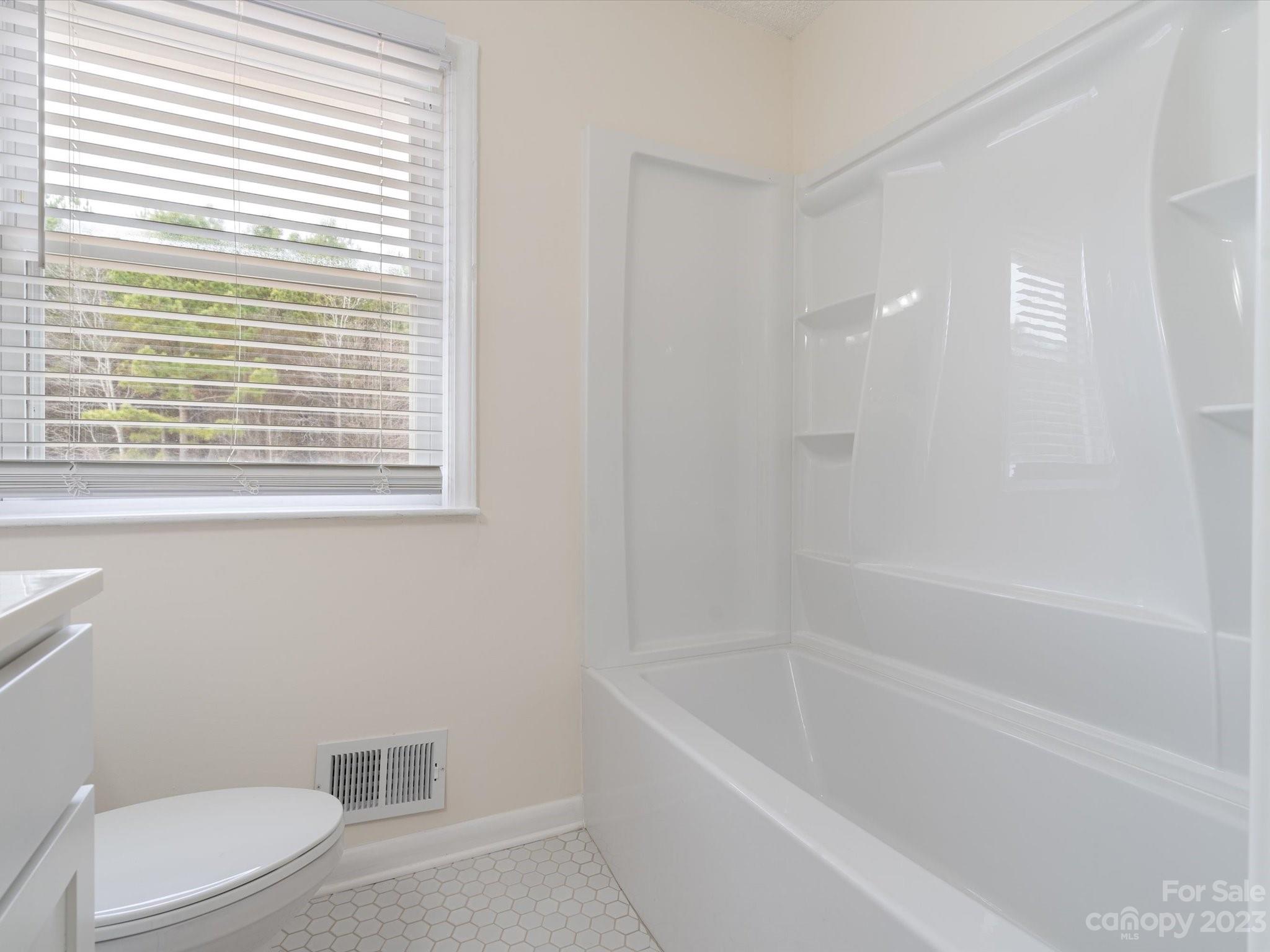 158 Baxter Road Cherryville, NC 28021 - Photo 23 of 38 a white bath tub sitting next to a toilet
