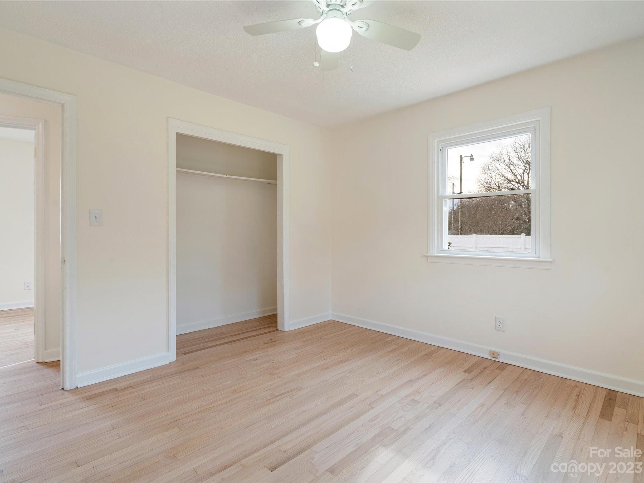 158 Baxter Road Cherryville, NC 28021 - Photo 25 of 38 an empty room with wooden floor and windows