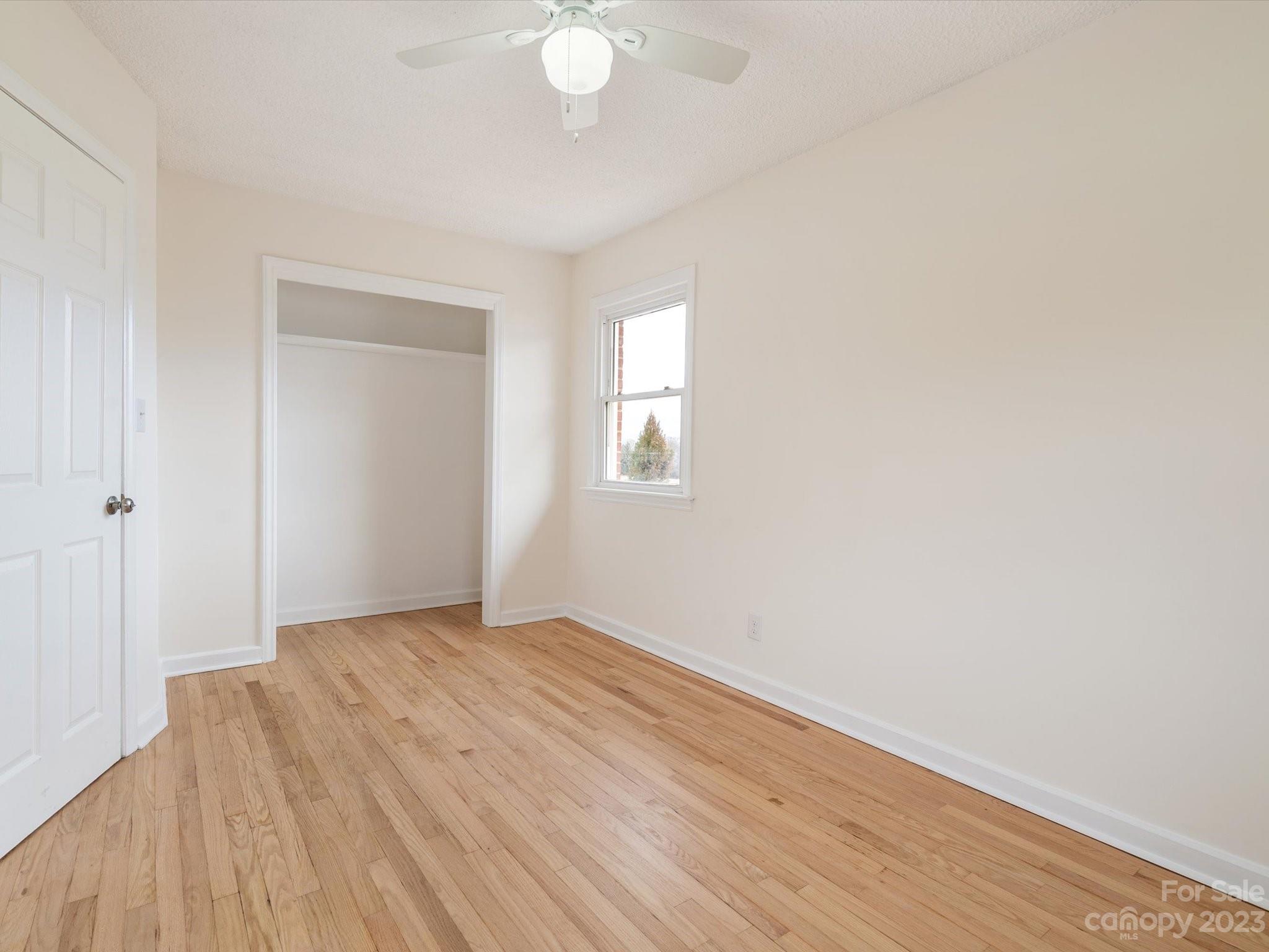 158 Baxter Road Cherryville, NC 28021 - Photo 27 of 38 an empty room with wooden floor and windows