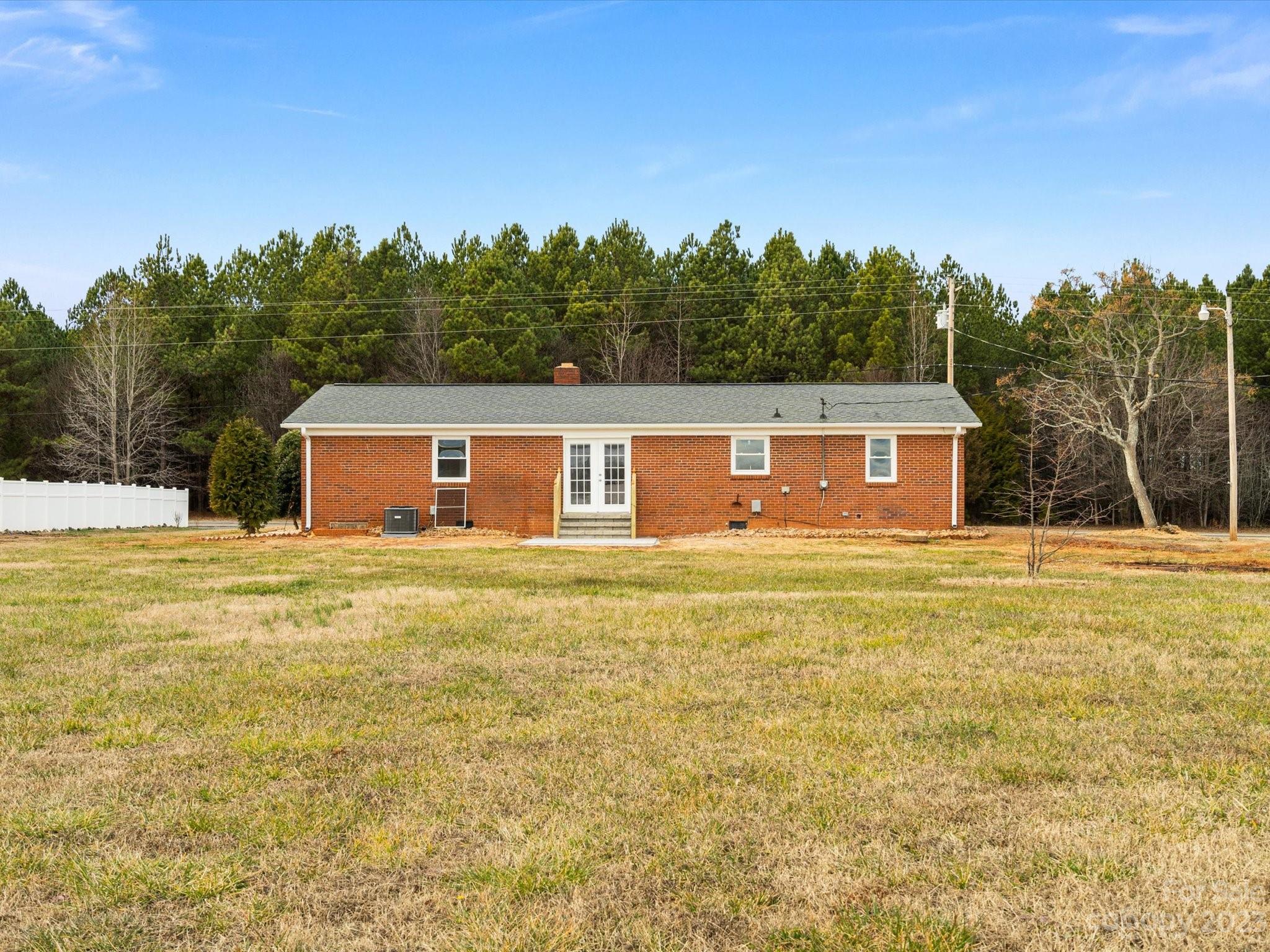 158 Baxter Road Cherryville, NC 28021 - Photo 30 of 38 a view of a house with swimming pool and a yard