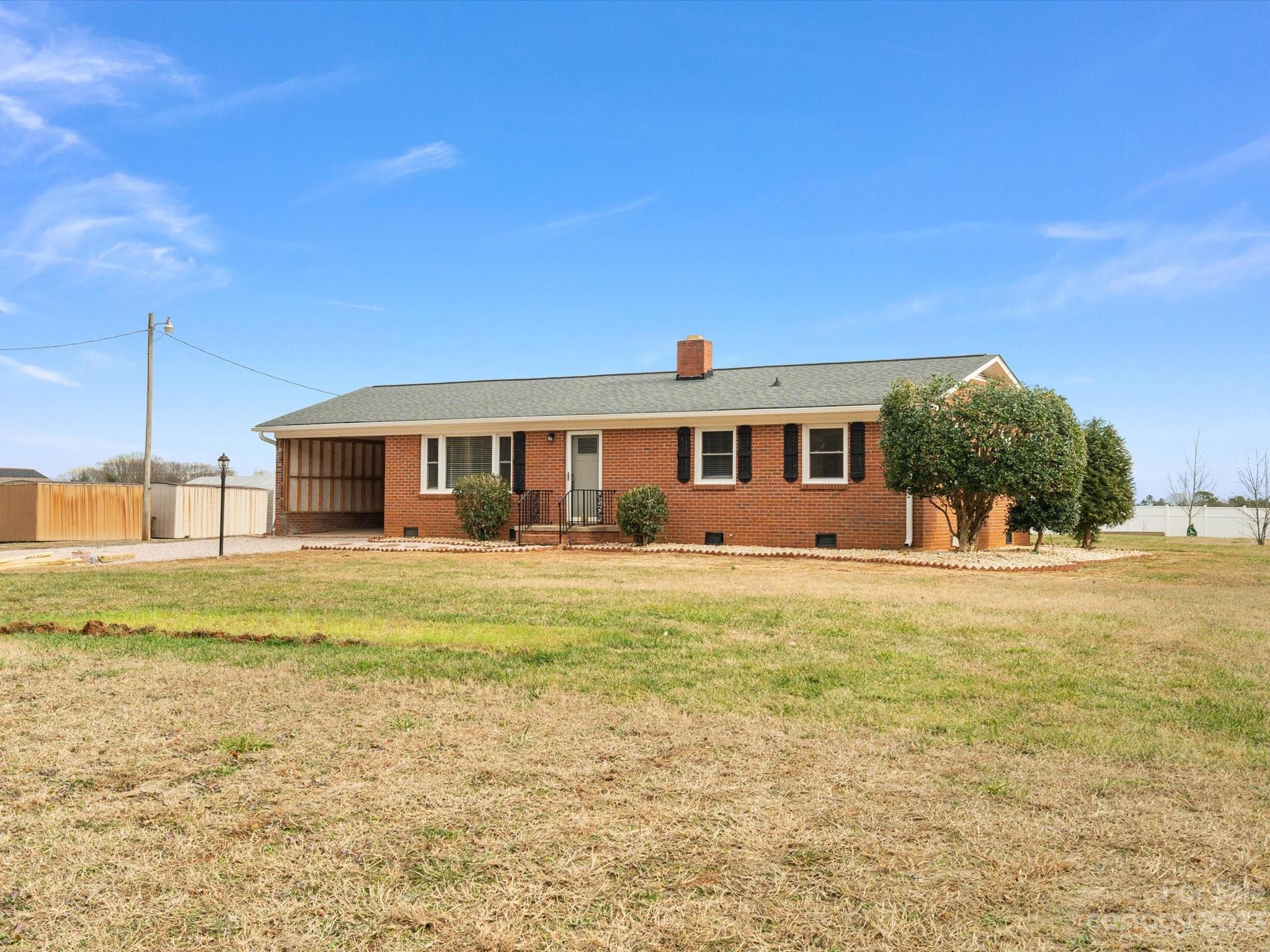158 Baxter Road Cherryville, NC 28021 - Photo 38 of 38 a front view of a house with a garden and yard