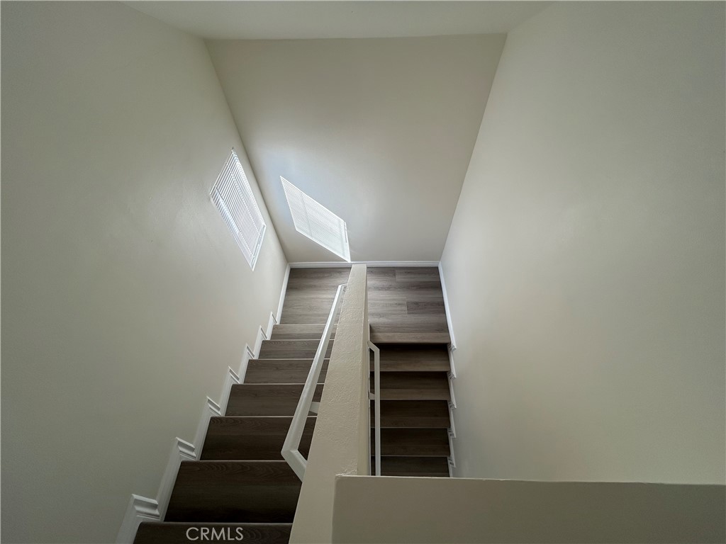 9079 Colony Place Riverside, CA 92503 - Photo 12 of 21 a view of entryway and hall with wooden floor