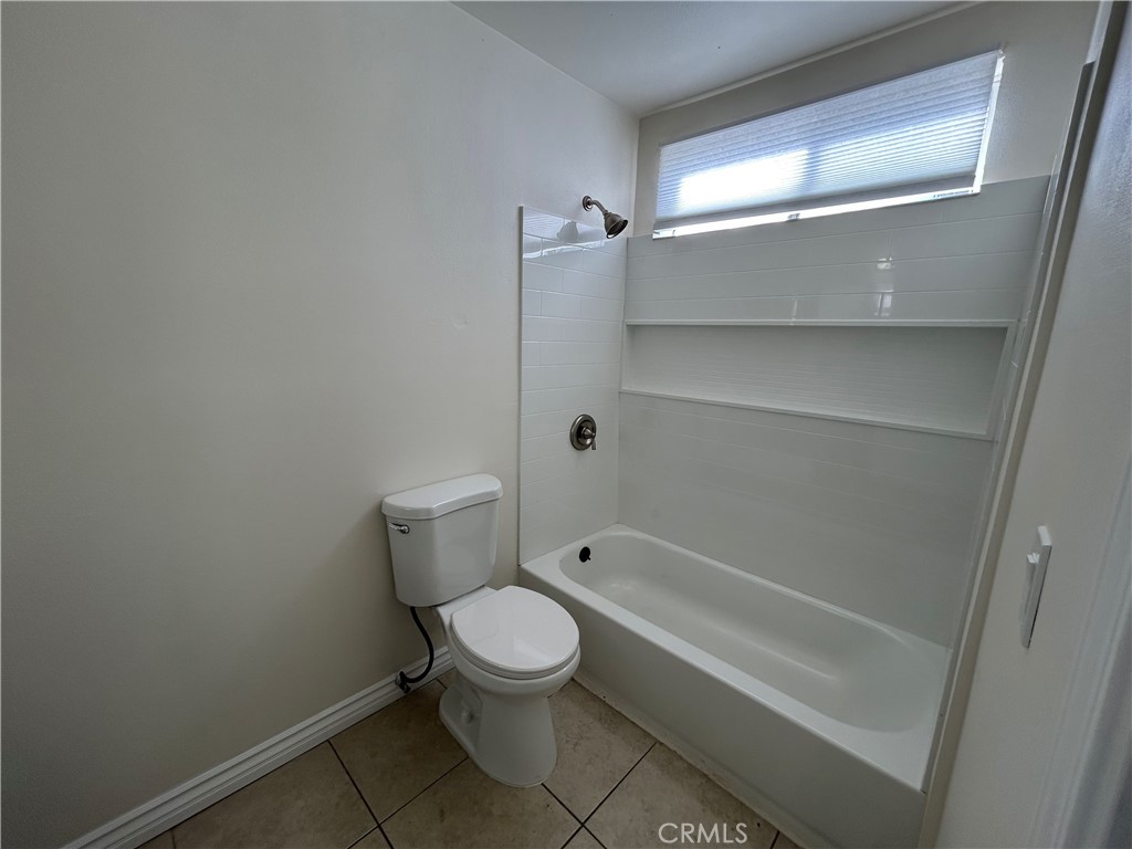 9079 Colony Place Riverside, CA 92503 - Photo 15 of 21 a bathroom with a toilet and shower