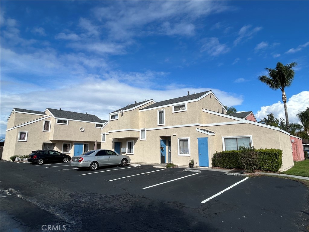 9079 Colony Place Riverside, CA 92503 - Photo 2 of 21 a front view of a house with cars parked on road