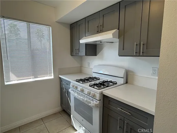 a kitchen with a stove and a microwave